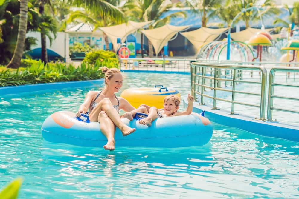 Mom and son have fun at the water park.
