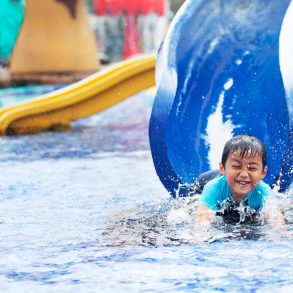 child having fun on a slide at the outer banks water park