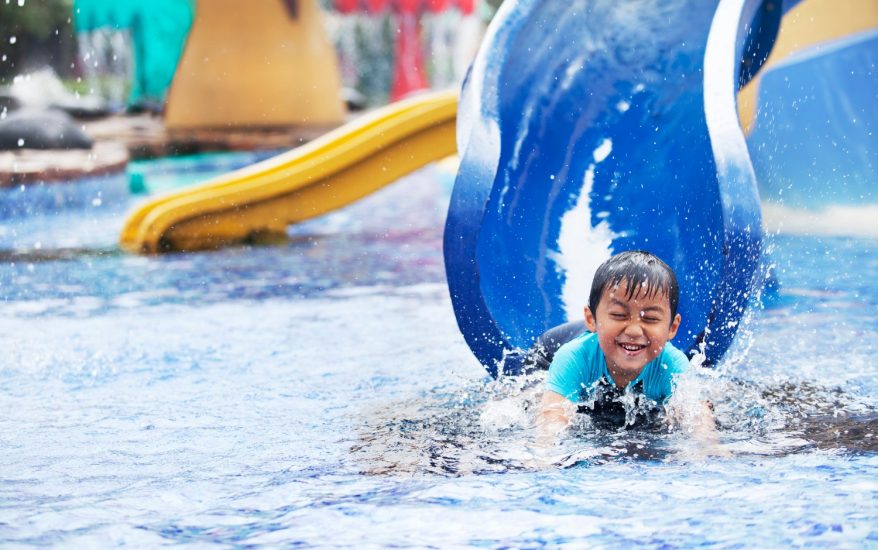 child having fun on a slide at the outer banks water park