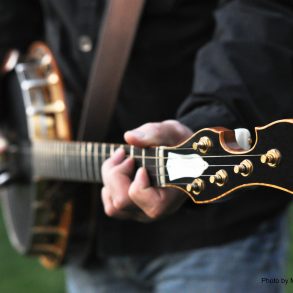 someone playing the banjo at the outer banks bluegrass festival