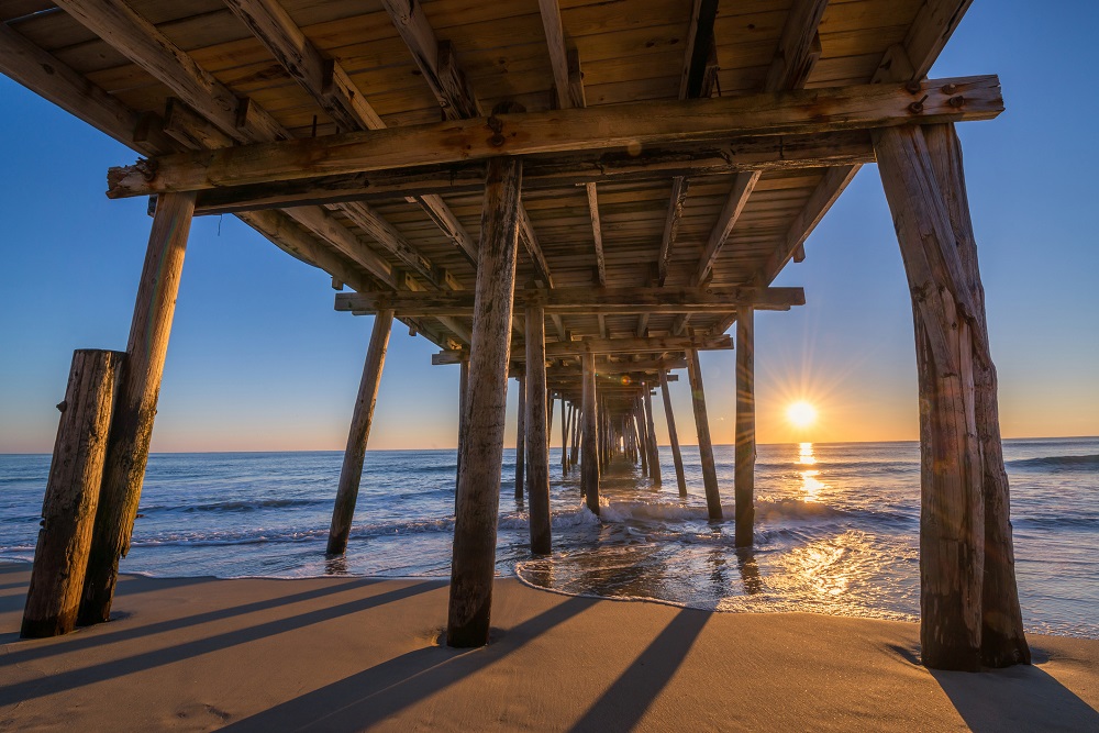 Underneath Nags Head Pier at sunrise