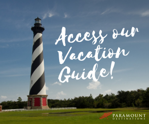 Cape Hatteras lighthouse black and white stripes. text reads access our vacation guide. 