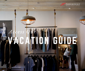 boutique store clothes hanging on racks text reads access our vacation guide