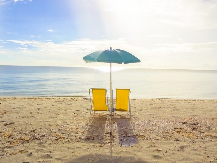 After stormy weather the sun came up and offered a lonesome beach and a beautiful glassy water surface at the Gulf of Mexico.