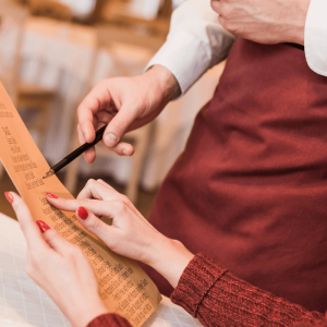 woman ordering from a menu at a Duck restaurant
