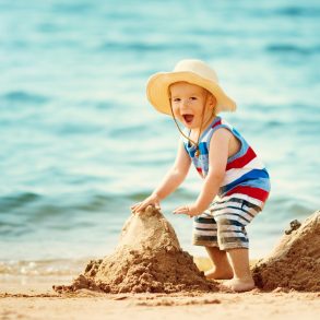 Child at the Beach Playing in Sand