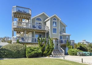 outside of Crabby Mermaid vacation rental with winding stairs