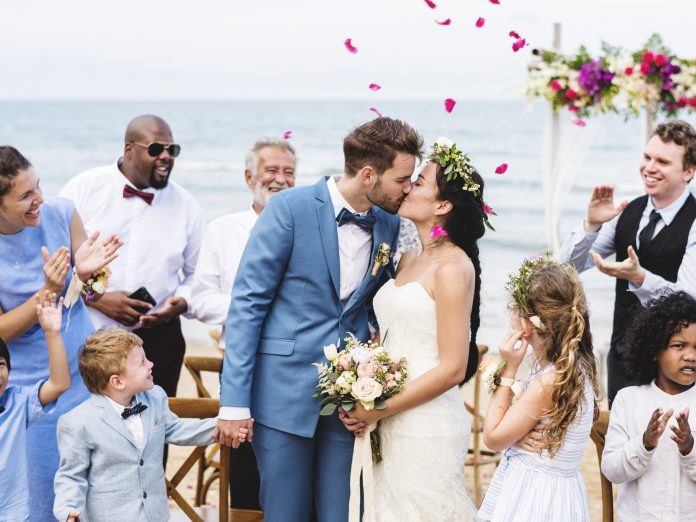outer banks wedding venues on beach, bride and groom and guests