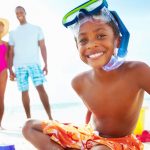 family on the beach with sand toys, family activities on outer banks