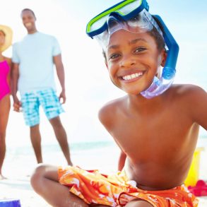 family on the beach with sand toys, family activities on outer banks