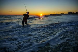 Man surf fishing