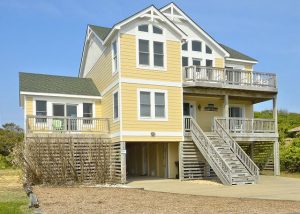 yellow vacation rental exterior on outer banks