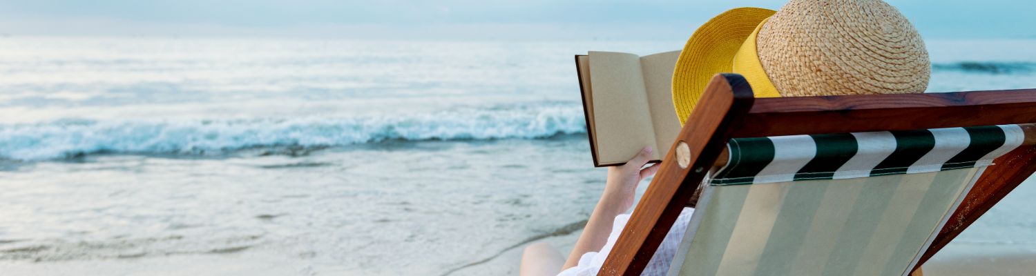 reading a book on a the beach