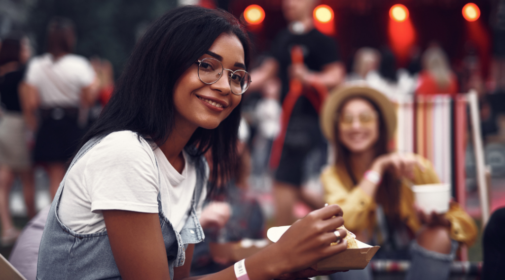woman at festival eating food
