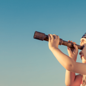 boy looking through telescope