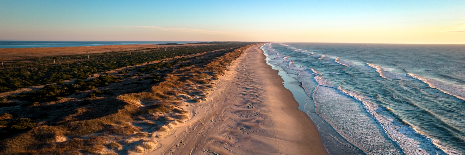 Aerial view of coastline and sand dunes in Outer Banks, North Carolina