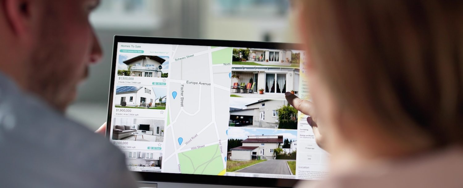 couple looking at vacation rentals online as they plan a vacation