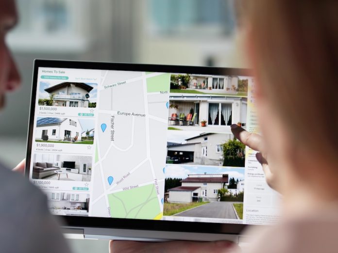 couple looking at vacation rentals online as they plan a vacation